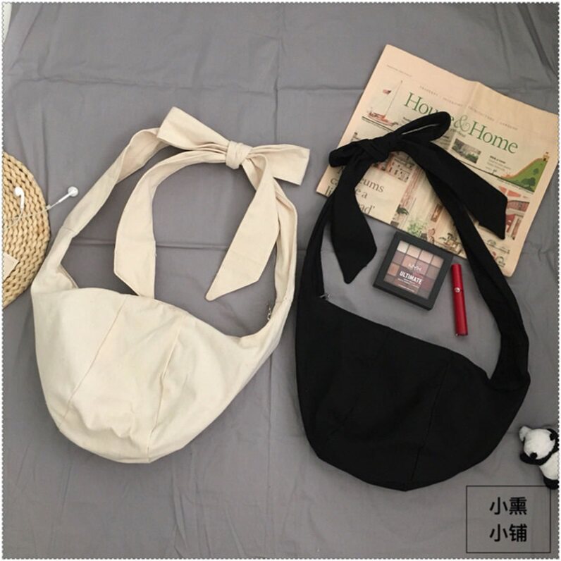 网红小布包韩国ins同款单肩斜跨包系带打结饺子包宽肩带帆布包袋