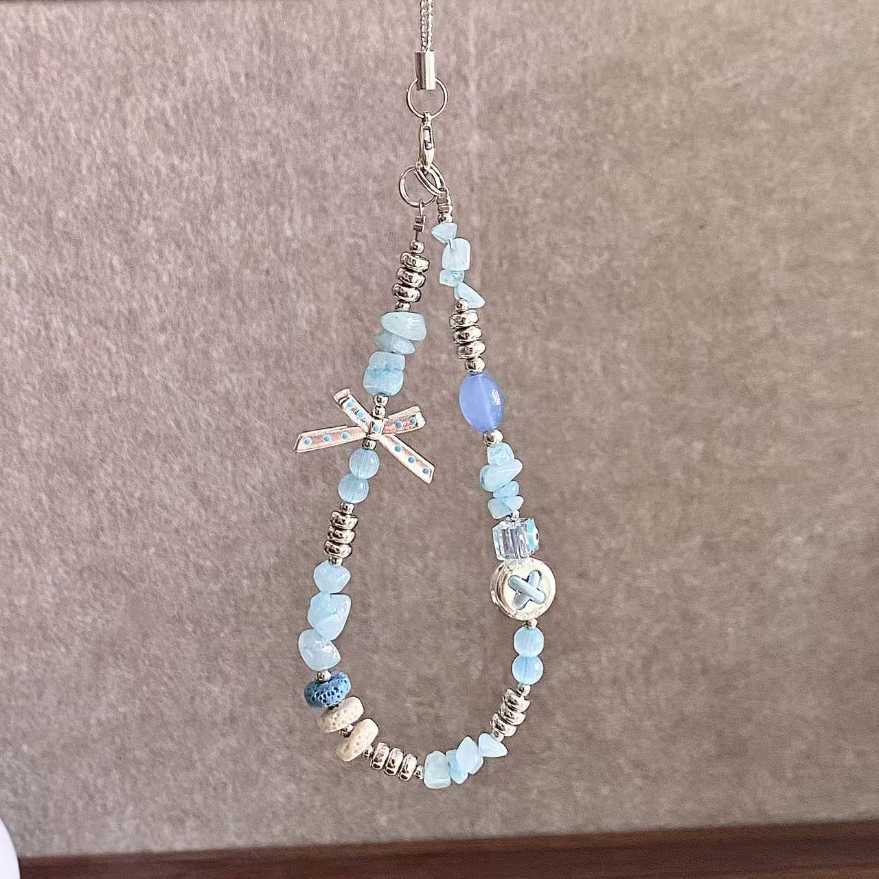 金洋壳碎石蝴蝶结手机链新品促销