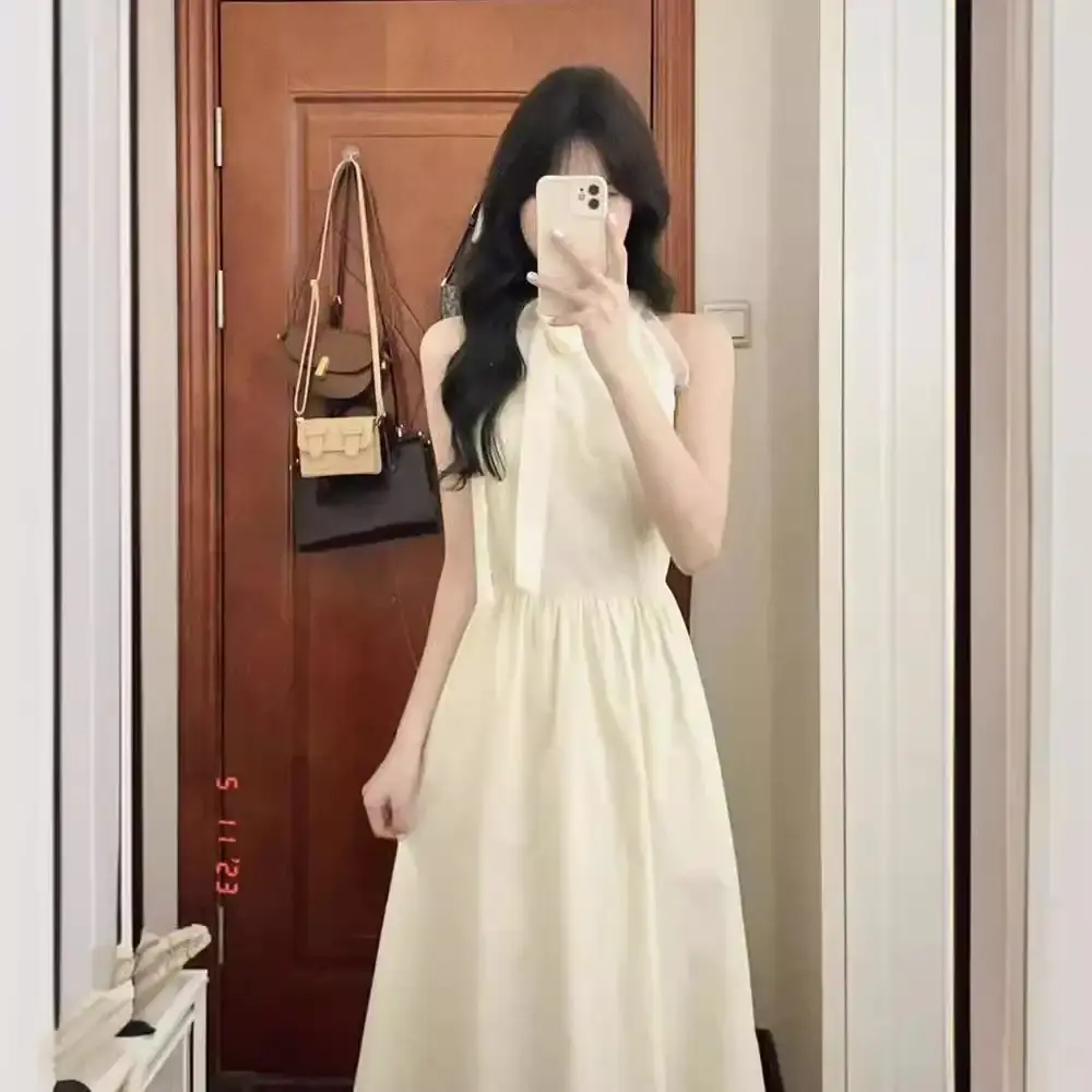 初恋小白裙学院风甜美蝴蝶结挂脖收腰气质连衣裙女学生夏日中长裙