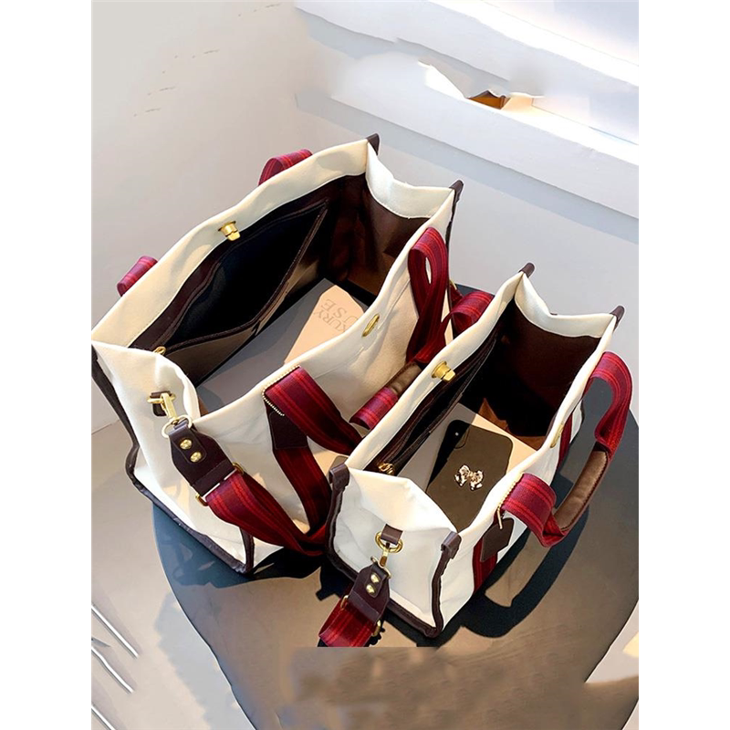 红色帆布包女士2026新款大容量大学生上班通勤撞色手提单肩斜挎包