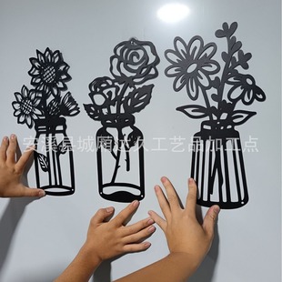 A set of 3 metal floral wall decorations, minimalist metal