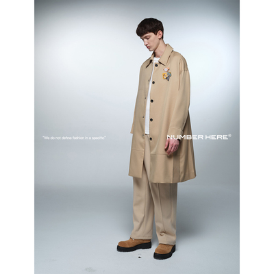 NUMBER HERE进口梭织面料原创图案下摆拼接设计长款风衣