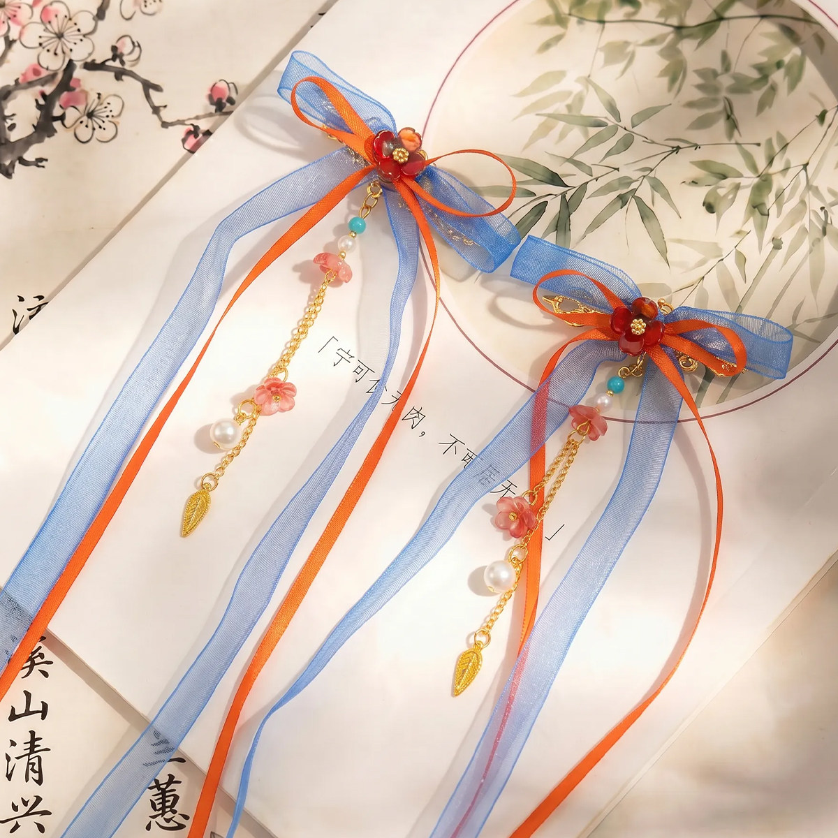 萌乎·云间橙影女童2026新款儿童头饰古风汉服小夹子蓝橙飘带发饰图片