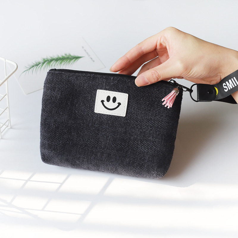 韩系简约笑脸卫生巾收纳包学生短绒流苏手腕包手机化妆收纳包