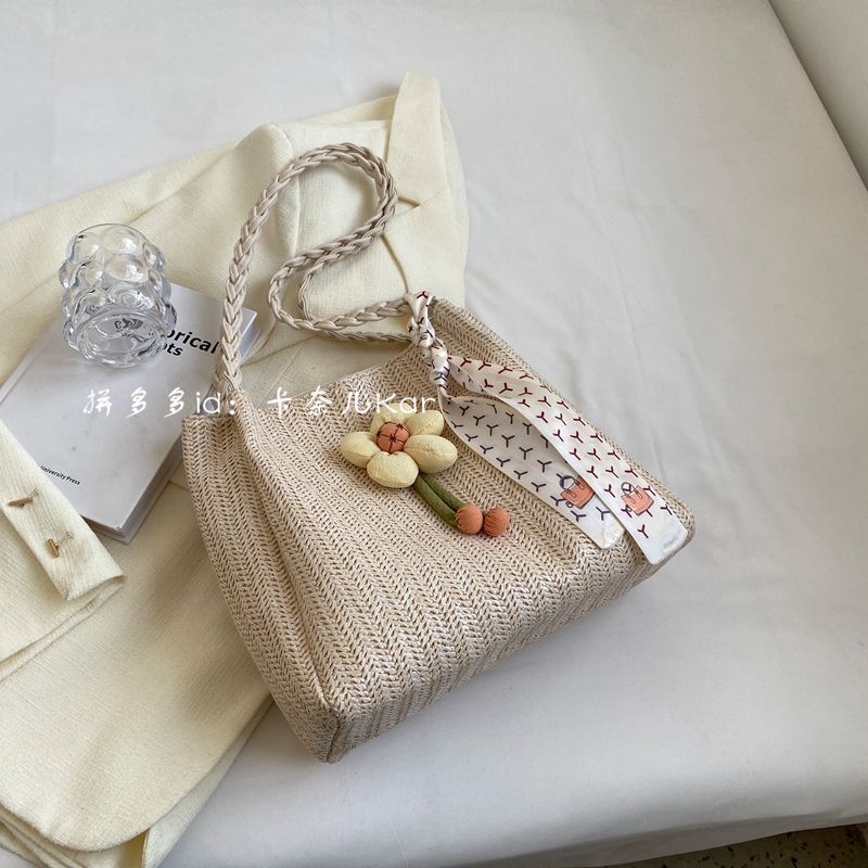 小众编织水桶包包2025新款上课通勤托特包女大容量度假单肩草编包