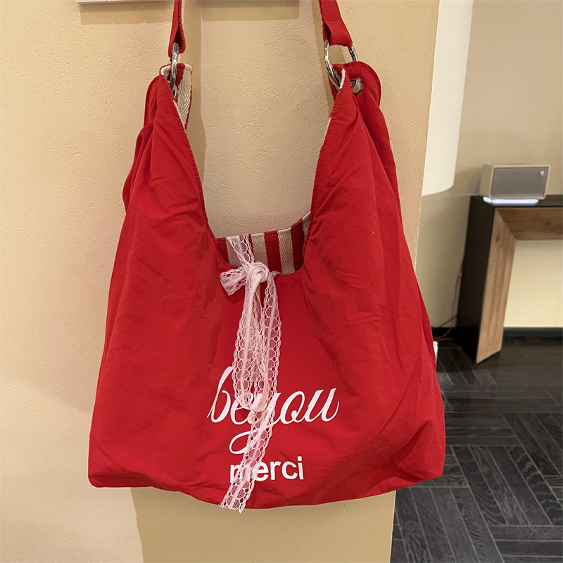 条纹帆布包包女夏天2025新款潮韩国字母印花双面单肩包学生上课包