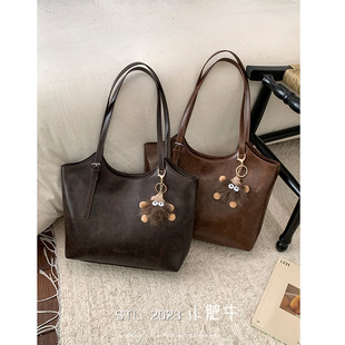 休闲简约风硬挺托特包包女2025新款小众中古百搭大容量通勤单肩包