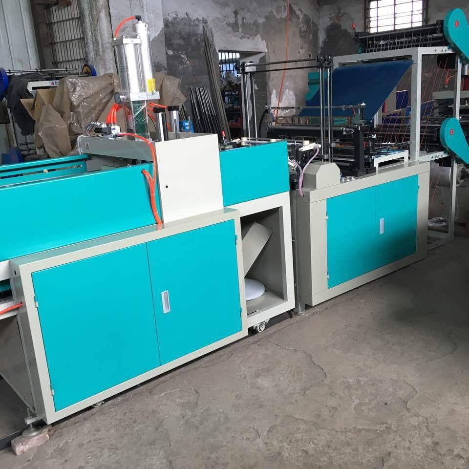 大量供应全自动塑料背心袋机器WT-700型电脑热封四道冷切制袋机