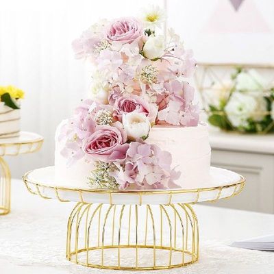 Golden wrought iron cake pan with glass cover White ceramic