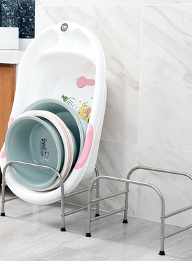 The stainless steel drops on the floor and the baby washes o