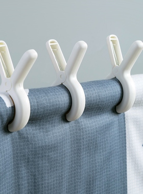 The house with the plastic clips, with the suncloths and the