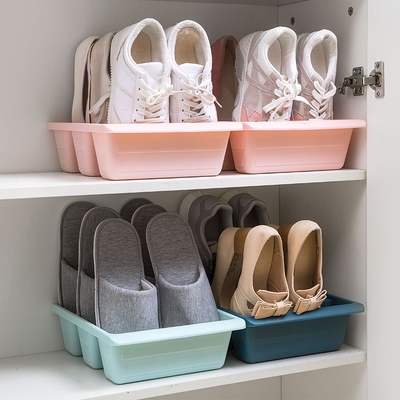 A plastic shoe box box containing shoes in a multi-storey sp