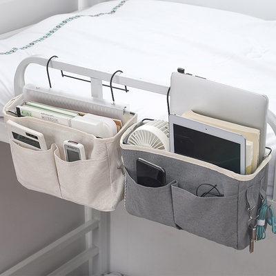 On the bedside shelf of the dormitory bed, there's a bag on