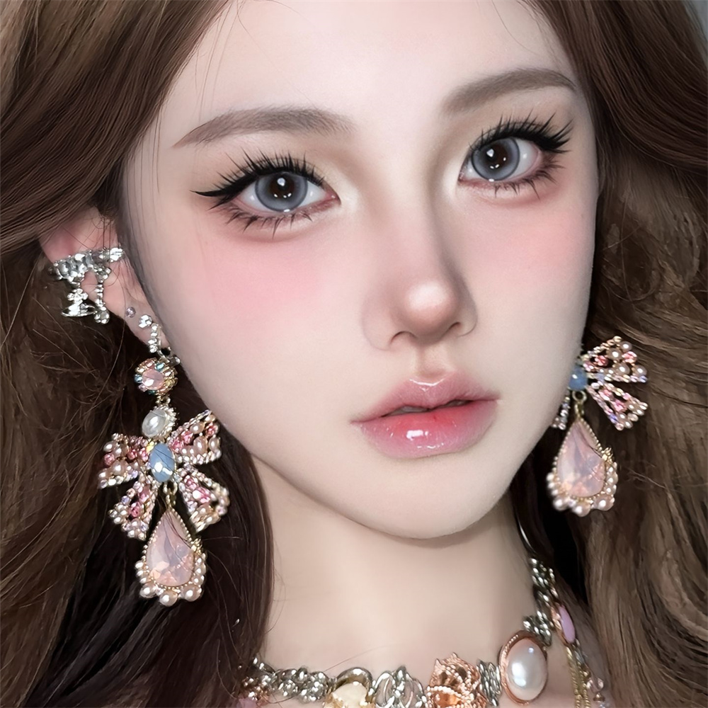 粉色夸张珍珠蝴蝶结耳环女