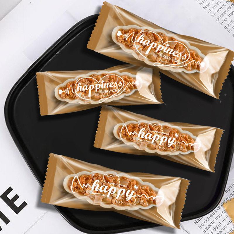 原创包字母糖牛轧装袋焦糖杏仁坚果酥糯米船包金底英文装袋长方形