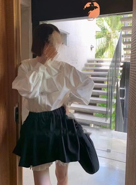 十三行冬季新款法式小众立领系带排扣显瘦白色休闲衬衫上衣女潮