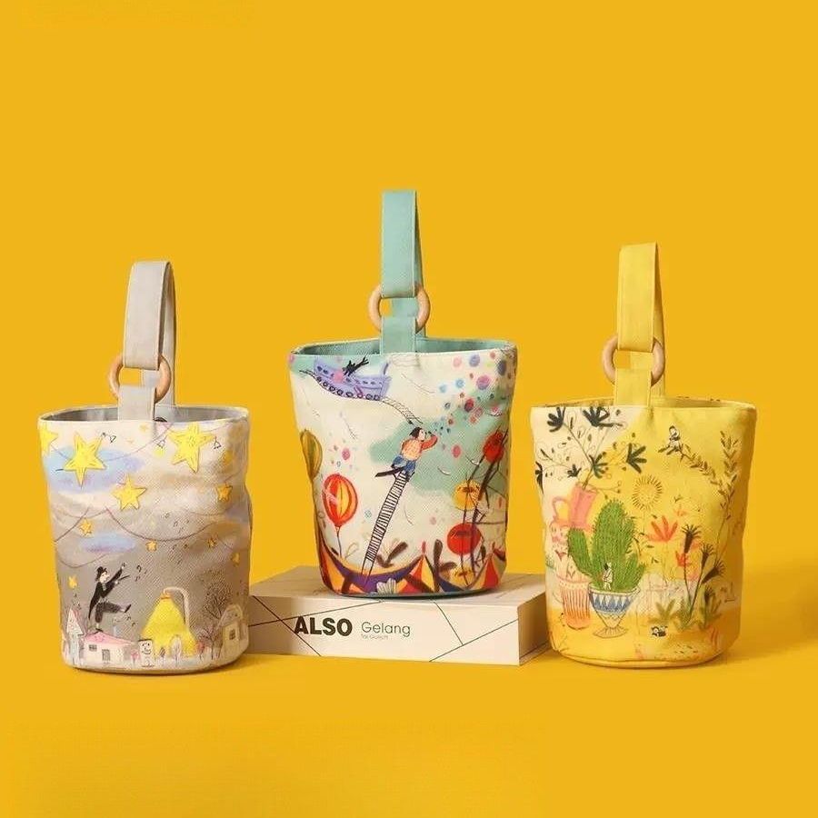 新款插画印花帆布水桶包随身小手提包妈咪包外出手拎包上班便当包