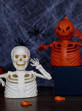 Crossing Halloween to decorate a skeletal electronic candlel