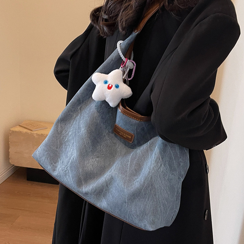 意尔康牛仔布大容量松弛感包包女2026新款学生上课通勤包单肩帆布