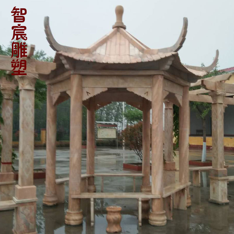 晚霞红石雕六角凉亭户外公园