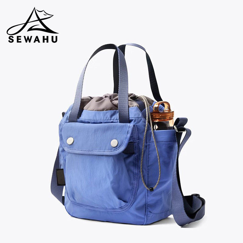 男女斜挎包春夏2026新款通勤轻便水桶包休闲百搭单肩包尼龙手提包