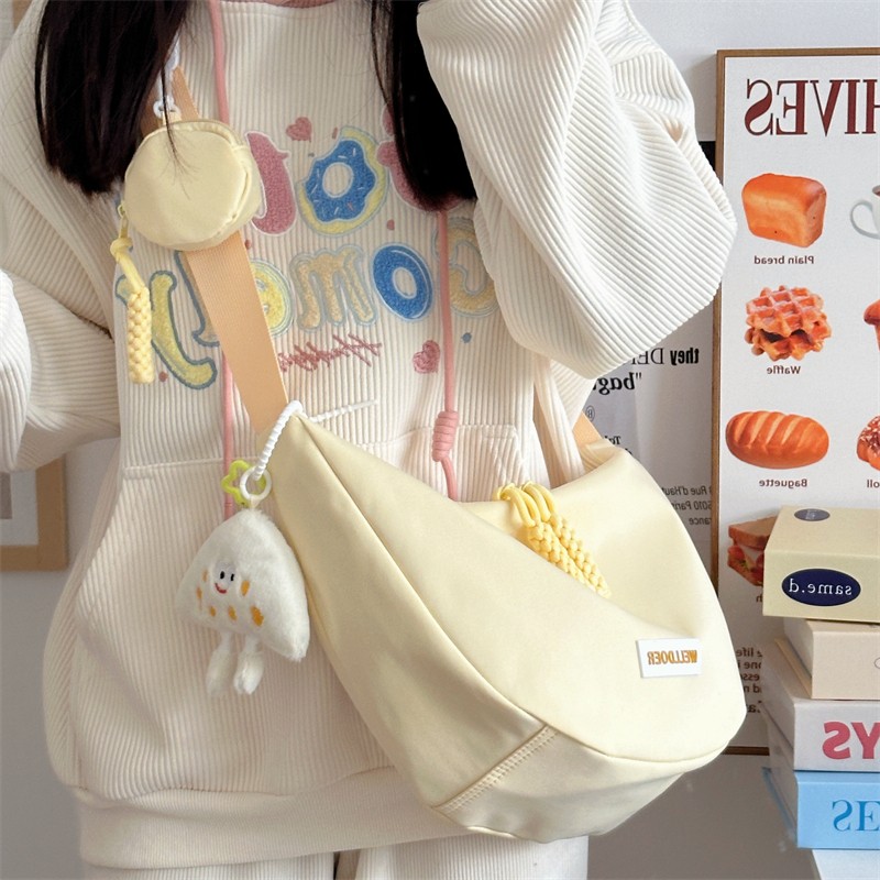 斜挎包女挎包饺子包2025新款女包布包通勤帆布学生大容量小包包布