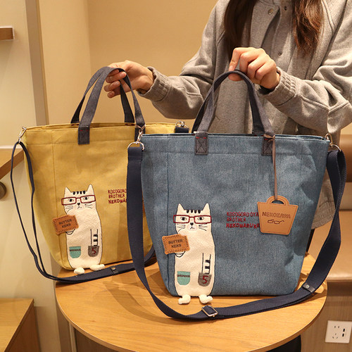 日本kusuguru眼镜猫刺绣可爱卡通单肩斜挎手拎包通勤学生补习袋