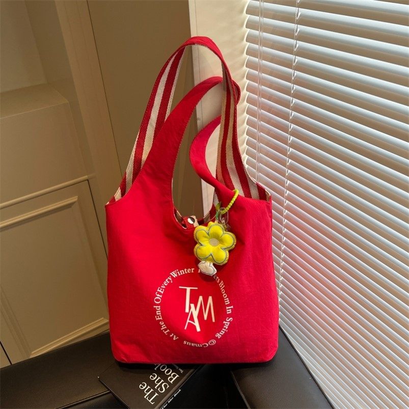 红色帆布包包女2025新款女式双面托特包休闲通勤大容量条纹单肩包