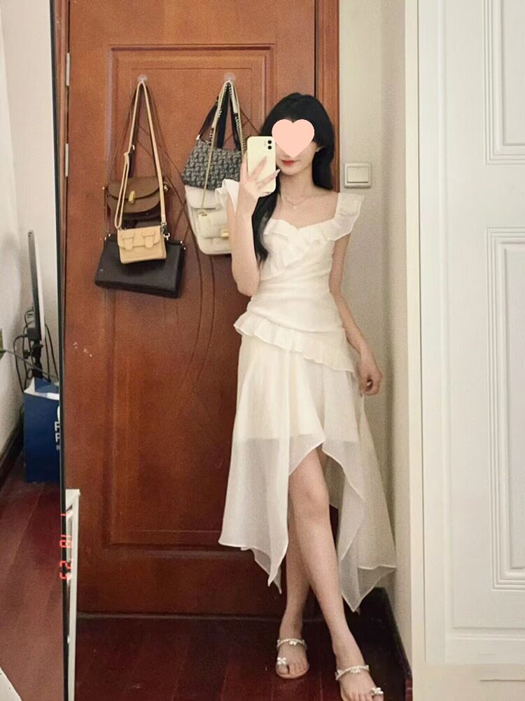 法式荷叶边白色不规则连衣裙女夏季2024新款海边度假裙子气质长裙