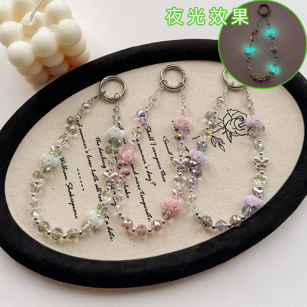 原创夜光玫瑰花手机链合金蝴蝶水晶耳机包包装饰高级感钥匙扣挂饰