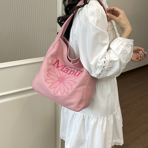 洋气百搭高级感刺绣帆布背包女2026年新款小众原创单肩手拎托特包