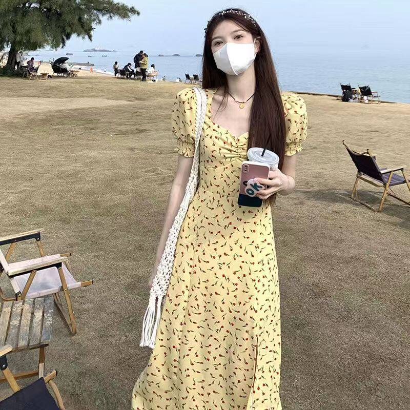 法式黄色碎花连衣裙女2024年春季新款高腰显瘦开叉裙子a字中长裙