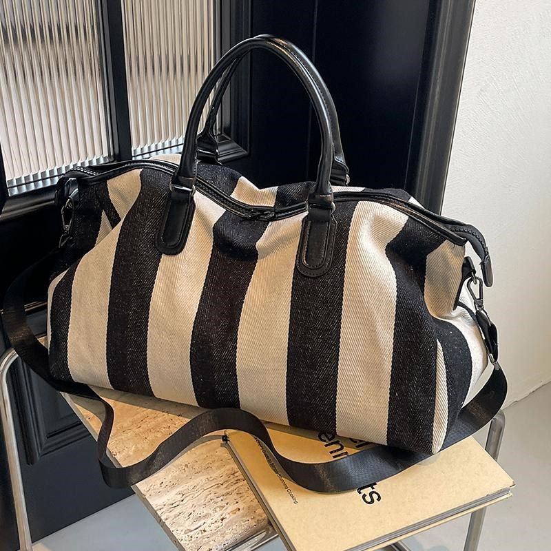 帆布大容量旅行包女短途出差通勤旅游手提包男便携行李袋登机包潮,箱包皮具/热销女包/男包,旅行袋,淘宝优惠券,粉丝福利购,淘宝优惠卷