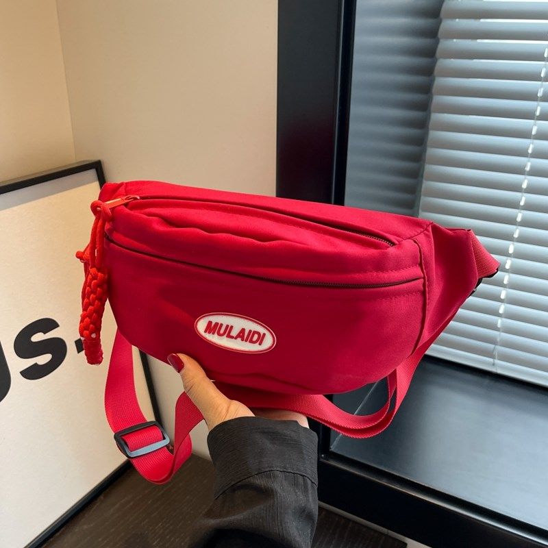 红色帆布小包包女2025新款轻便休闲百搭斜挎胸包运动跑步手机腰包