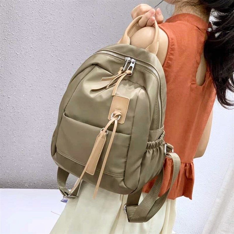 撞色双肩包女2025新款休闲男女款通用书包牛津布背包学生旅行包潮