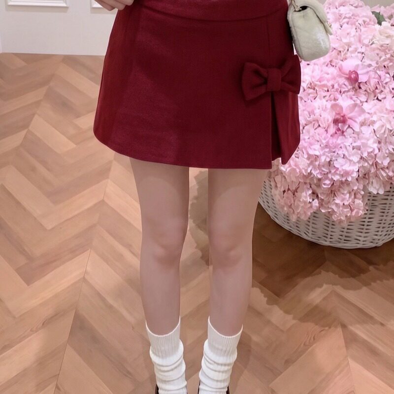 圣诞红色新年蝴蝶结a字半身裙女秋冬氛围感显瘦毛呢短裙
