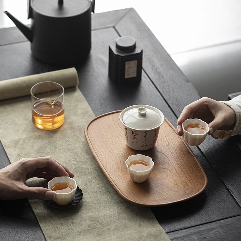 樱桃木茶托盘壶承 侘寂实木炭烧茶承干泡台小茶盘椭圆茶台图片