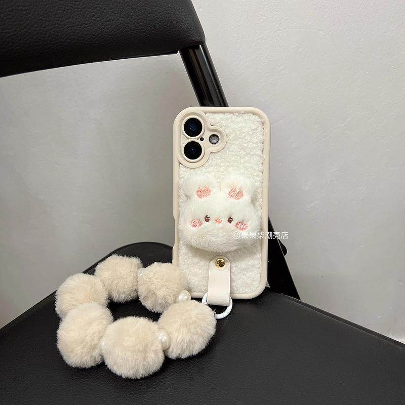 秋冬毛绒小兔头iPhone15promax手机壳腕带适用苹果16挂绳14/13/12