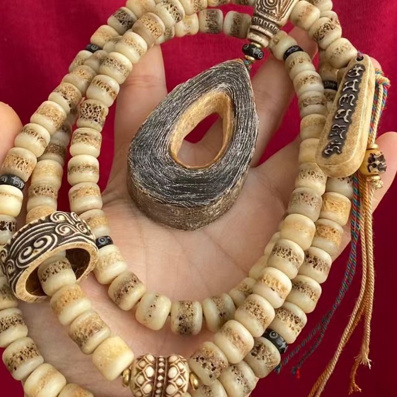 藏式牛骨嘎嘎108颗套装男女通用驼骨回流开片炸纹老形批发