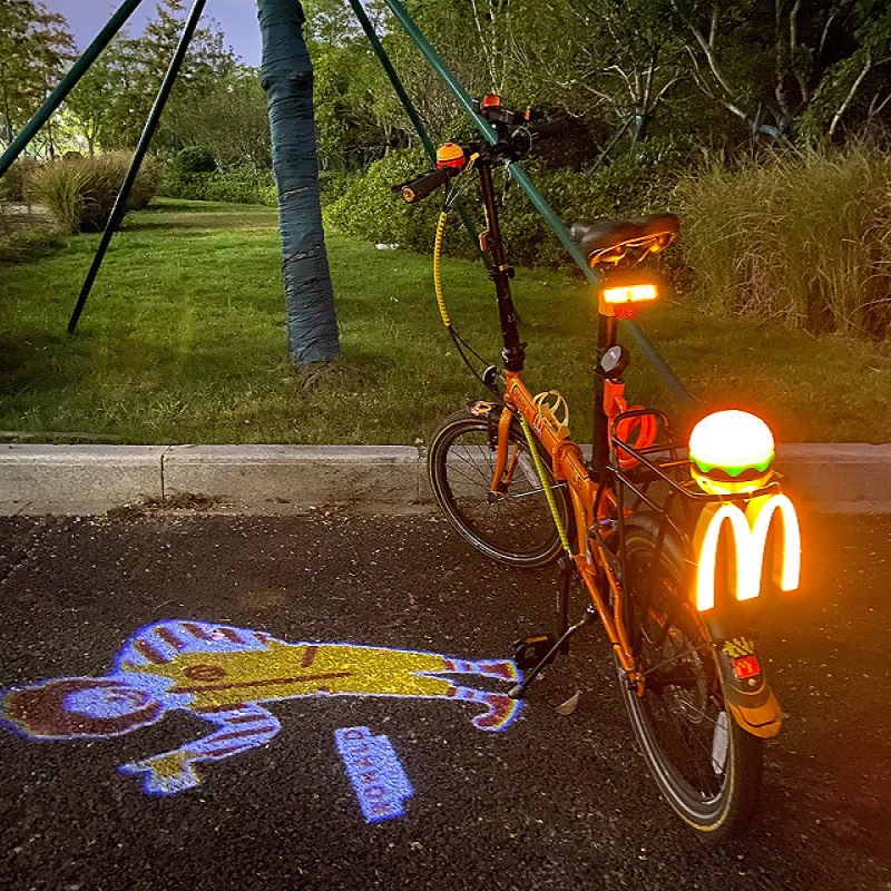 麦当劳卡通投影灯山地自行车公路车氛围灯夜骑灯单车脚踏车警示灯