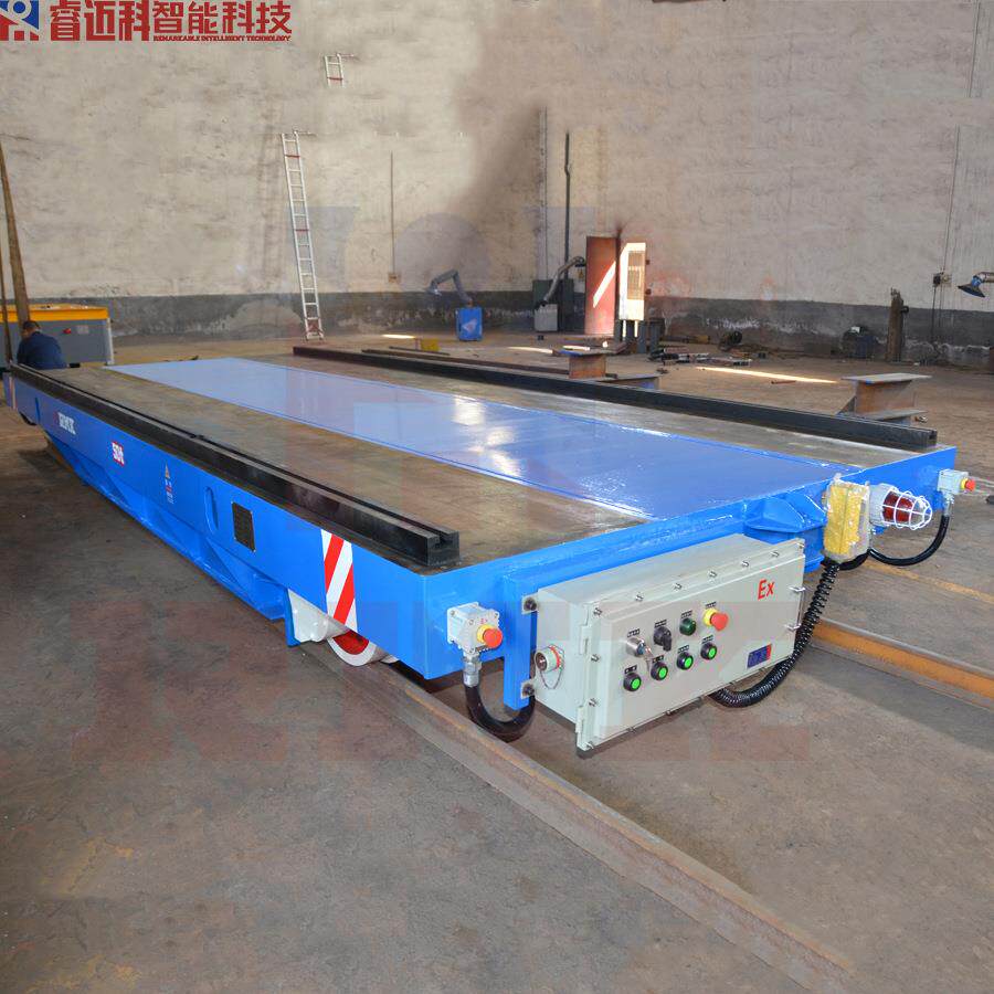 有钢轨的遥控操作电动过跨车 电机减速机驱动搬运平车 15吨平板车