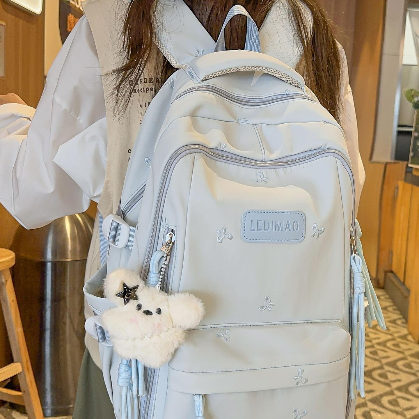 儿童书包女生小学生2025新款大容量初中生高中生多层轻便双肩揹包