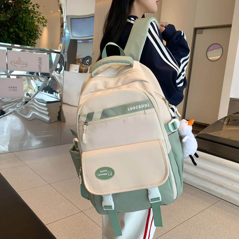书包初中女生大容量高中学生轻便减负三到六年级女孩背包双肩包