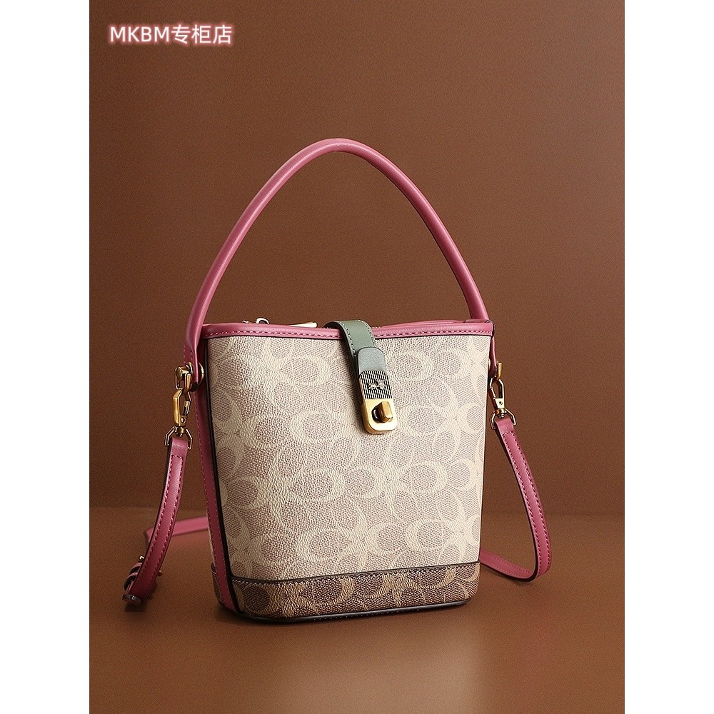 法国DUDK轻奢高级真皮覆古水桶包女新款流行小众单肩斜挎包手提包