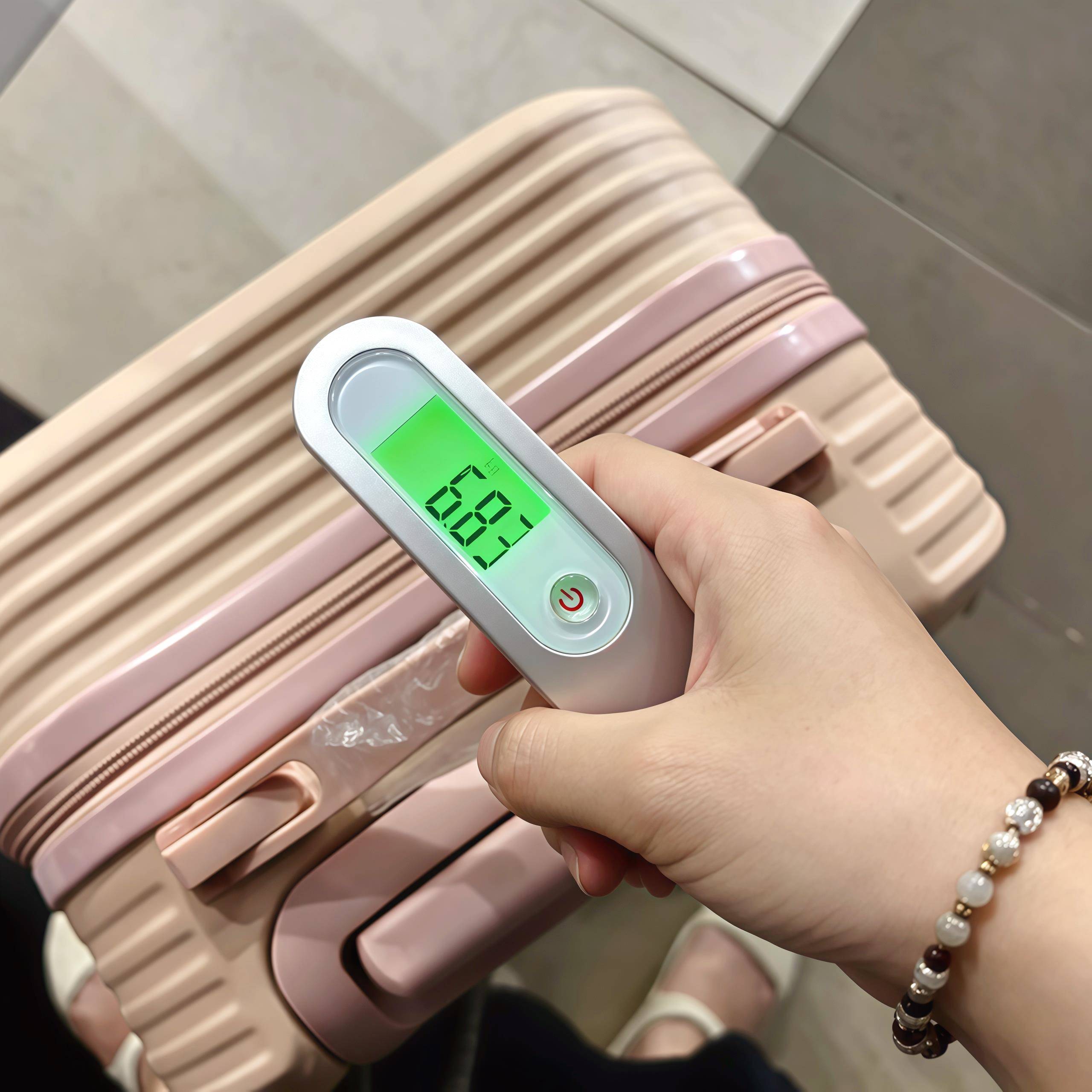迷你便行寄李秤手提电子秤50kg旅行出差坐飞携机精准称重邮快递用
