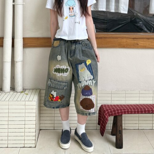 美式高街做旧卡通刺绣牛仔七分裤