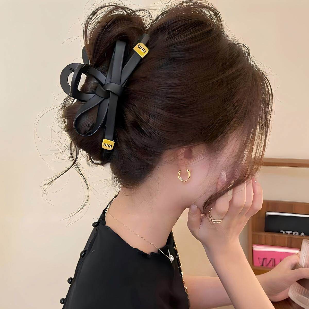 韩版高级感黑色皮质蝴蝶结抓夹图片