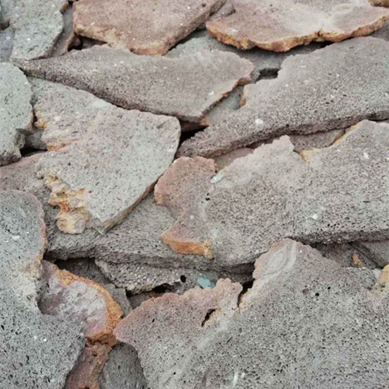 厂家直供红色不规则火山石板材 园林装饰黑色碎拼火山岩浮石板材