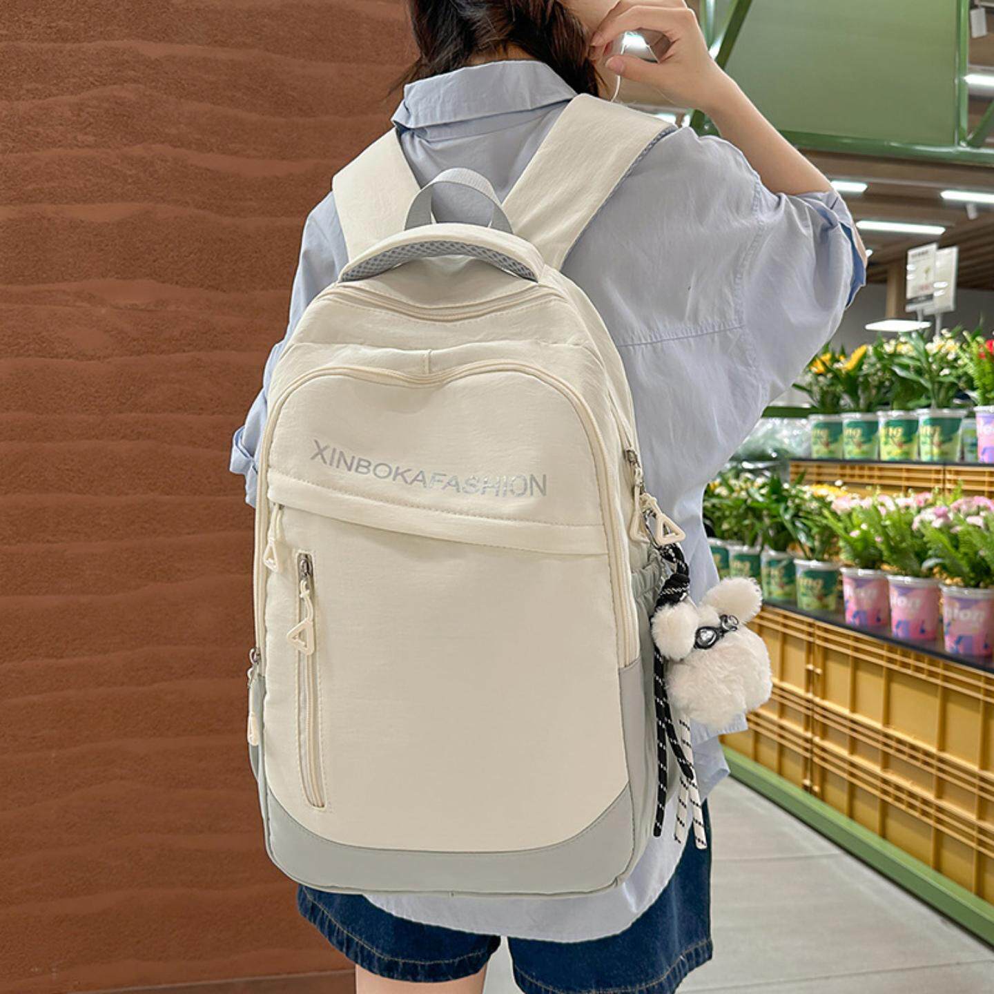 书包初中女生简约百搭大容量高中生背包休闲韩版潮大学生双肩包女