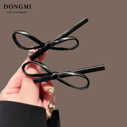 黑色皮质蝴蝶结鸭嘴夹